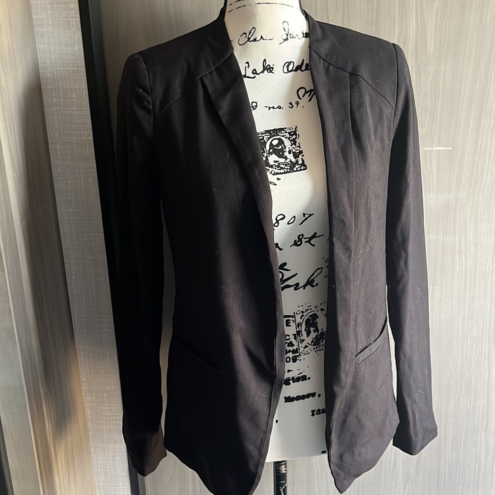 Black, collarless blazer